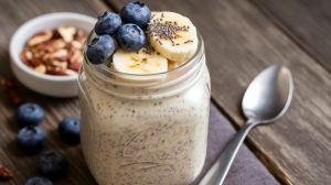 Jar of Overnight Oats topped with fruits and nuts, perfect for a quick and nutritious breakfast.